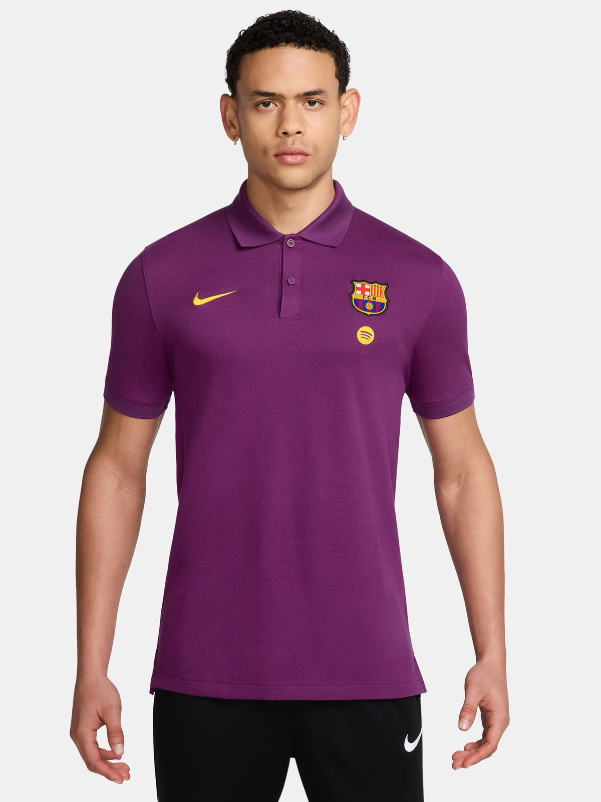 FC Barcelona polo shirt in a bold purple color. Featuring the iconic club crest and Spotify sponsor logo on the chest, alongside a yellow Nike swoosh. A stylish and versatile option to show your Barça pride beyond the pitch.
