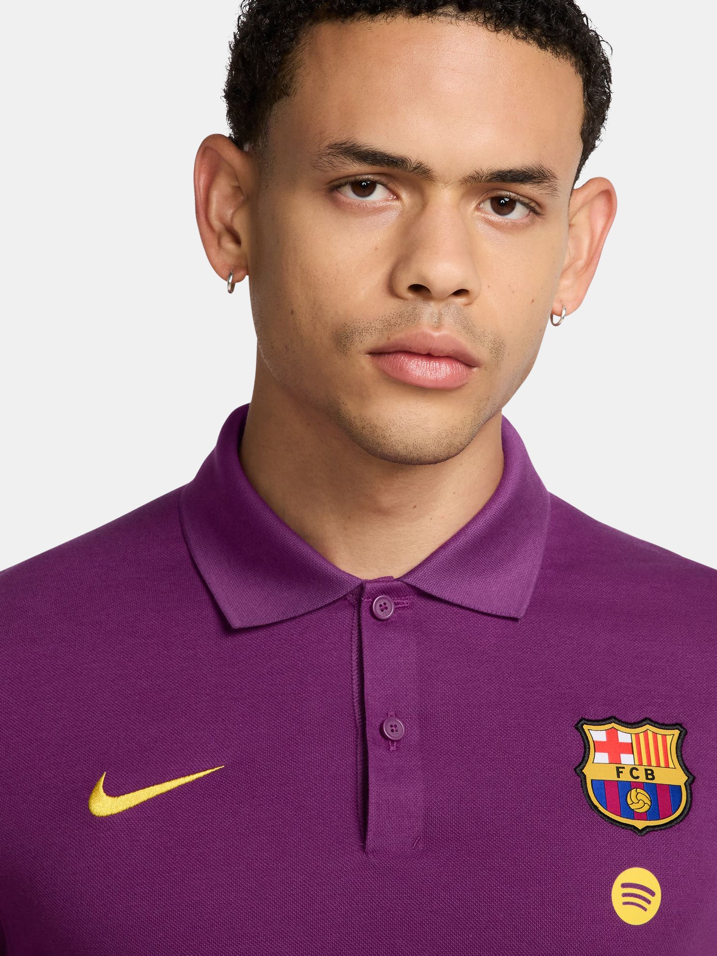 FC Barcelona polo shirt in a bold purple color. Featuring the iconic club crest and Spotify sponsor logo on the chest, alongside a yellow Nike swoosh. A stylish and versatile option to show your Barça pride beyond the pitch.
