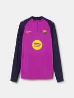 Purple and navy FC Barcelona Nike training top with long sleeves, featuring yellow swoosh, club crest, and Spotify logo on the front.
