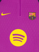 Purple and navy FC Barcelona Nike training top with long sleeves, featuring yellow swoosh, club crest, and Spotify logo on the front.