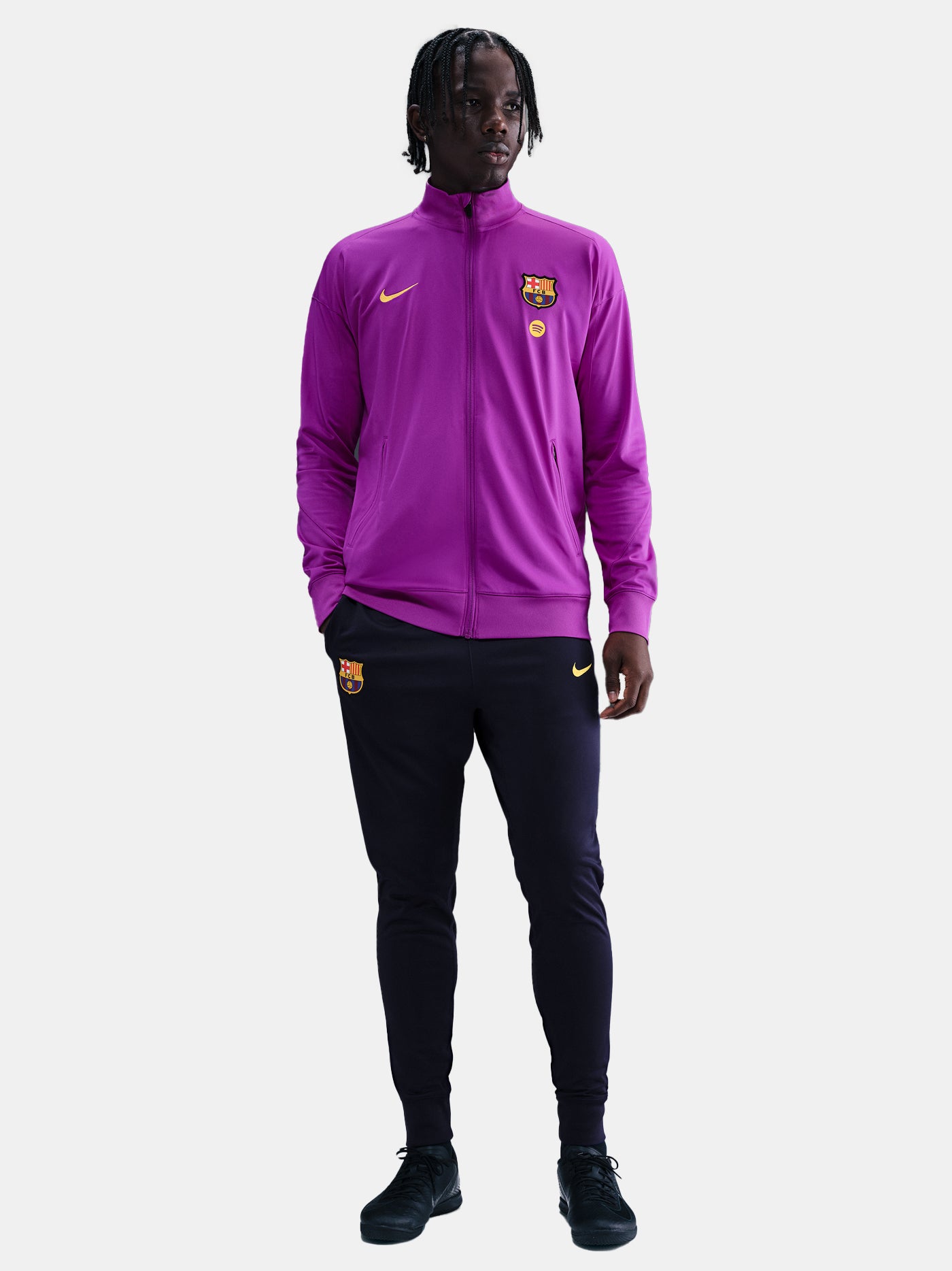 FC Barcelona 25/26 purple full-zip tracksuit front view with club crest, Nike logo and navy slim-fit training pants