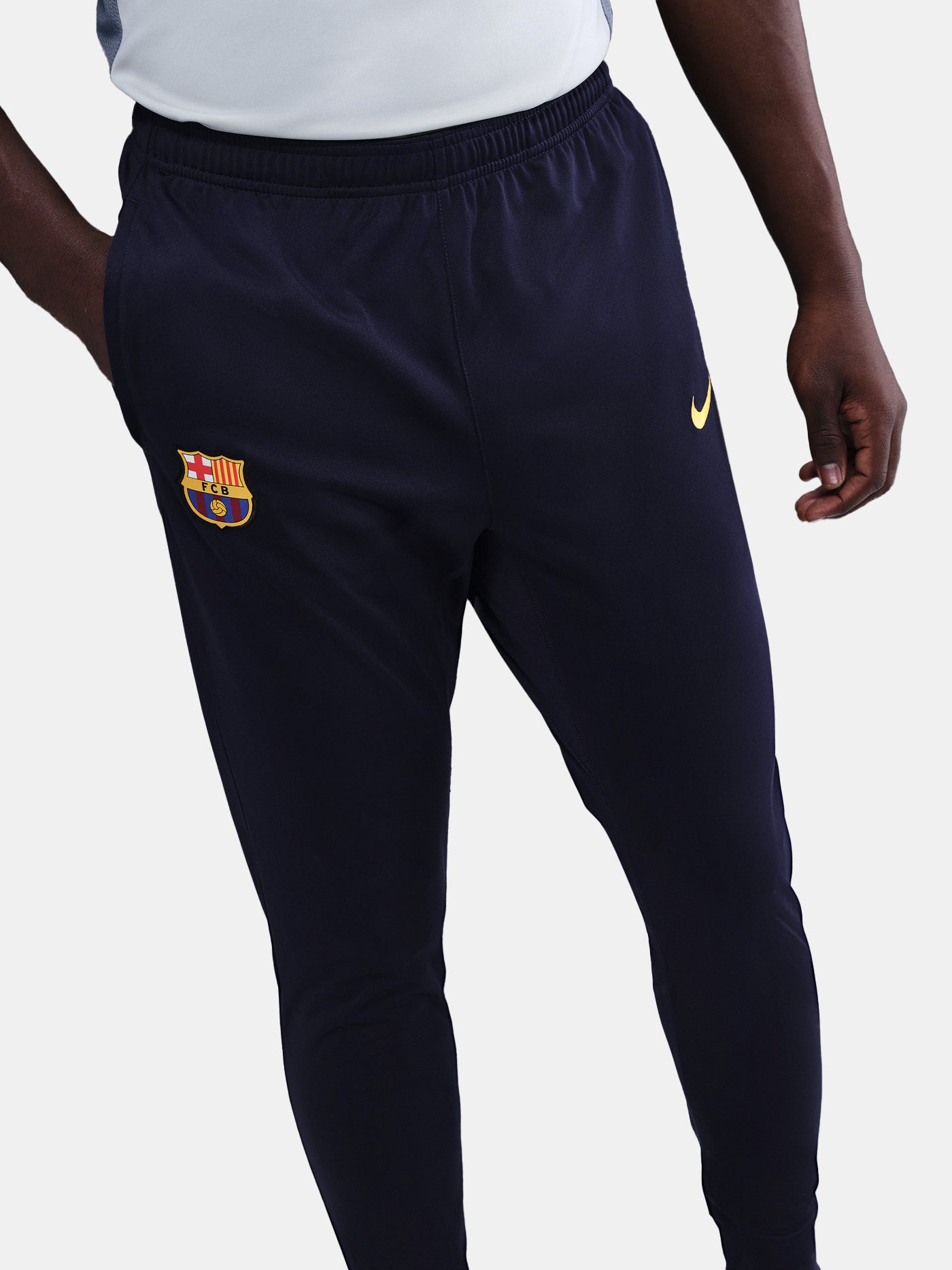 FC Barcelona 25/26 navy training pants front detail with club crest and Nike logo