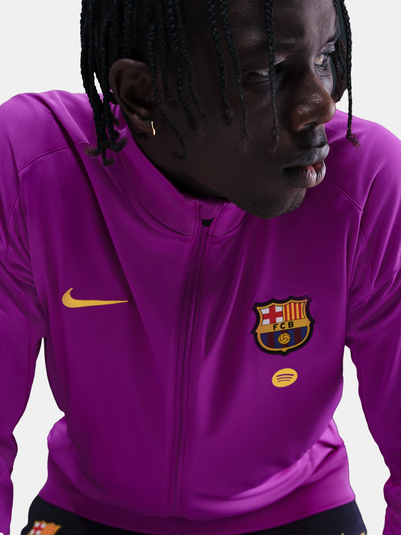 Detail of FC Barcelona 25/26 purple training jacket with club crest, Nike swoosh and sponsor logo on chest