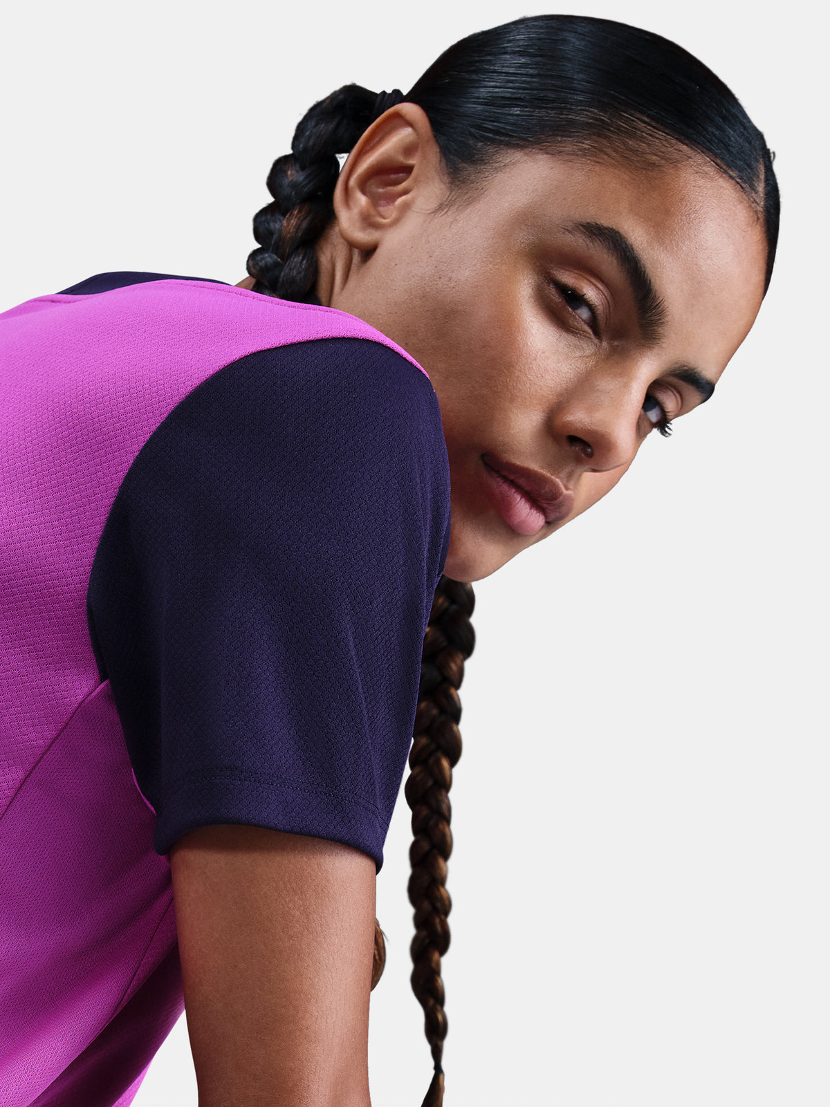 Women's purple FC Barcelona training jersey with navy sleeves, yellow Nike logo, club crest, and Spotify sponsor on the front.