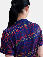 Women's FC Barcelona pre-match jersey with multicolor wave pattern, yellow Nike logo, club crest, and Spotify sponsor on the front.