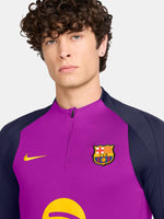 Purple FC Barcelona training top with quarter-zip, navy sleeves, yellow Nike logo, club crest, and Spotify sponsor on the front