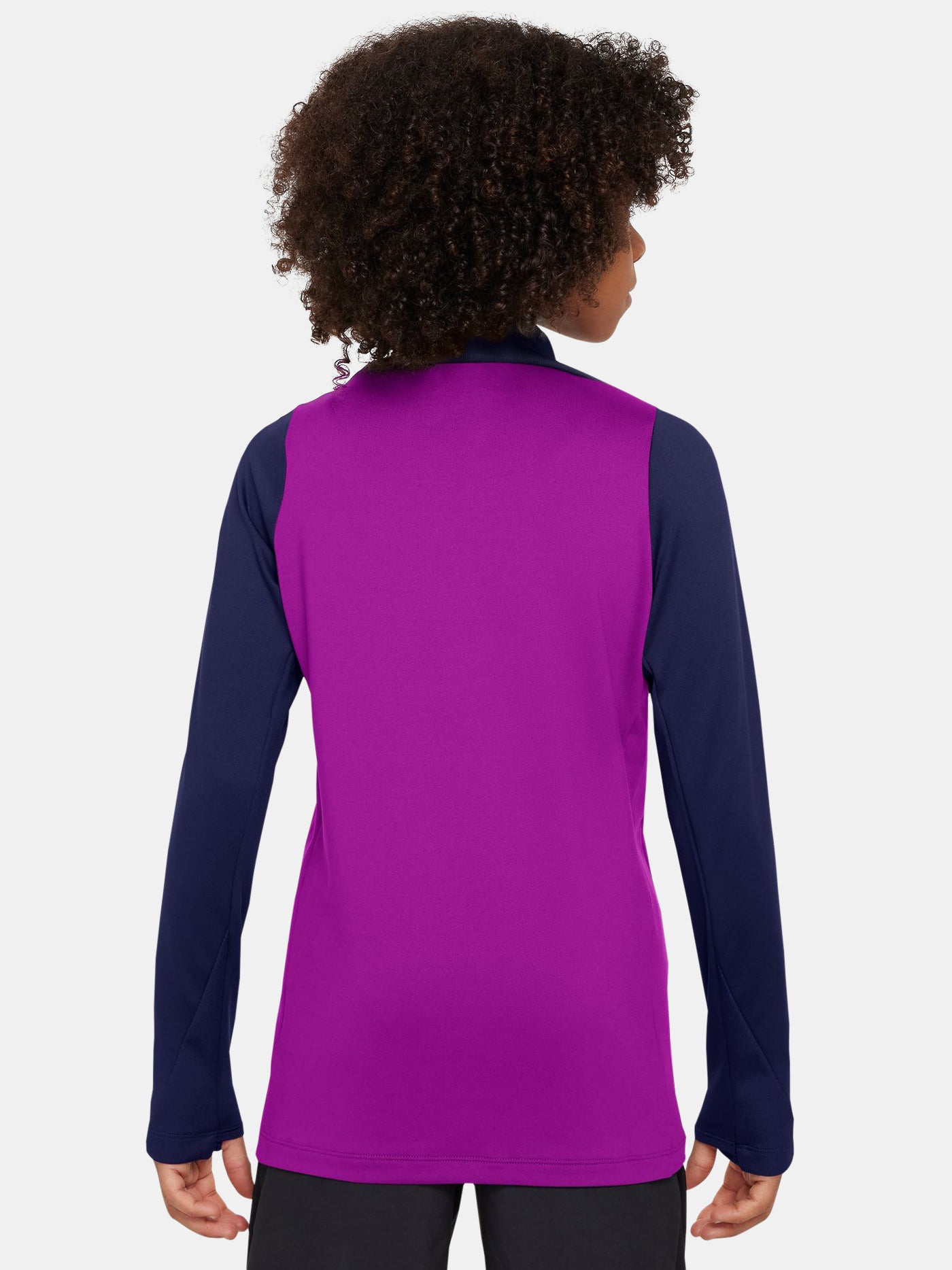 FC Barcelona long-sleeve training top for kids in a vibrant purple body with navy blue sleeves. The top features a yellow Nike swoosh, the Spotify sponsor logo in yellow, and the official Barça crest on the chest. Designed with a half-zip neckline for adjustable ventilation and performance-ready comfort.
