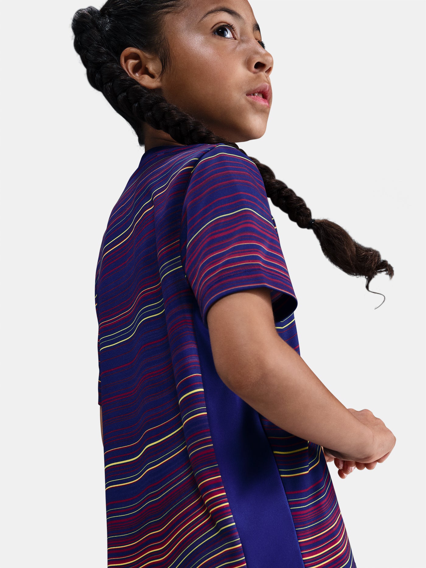 Junior FC Barcelona pre-match jersey with multicolor wave pattern, yellow Nike logo, club crest, and Spotify sponsor on the front