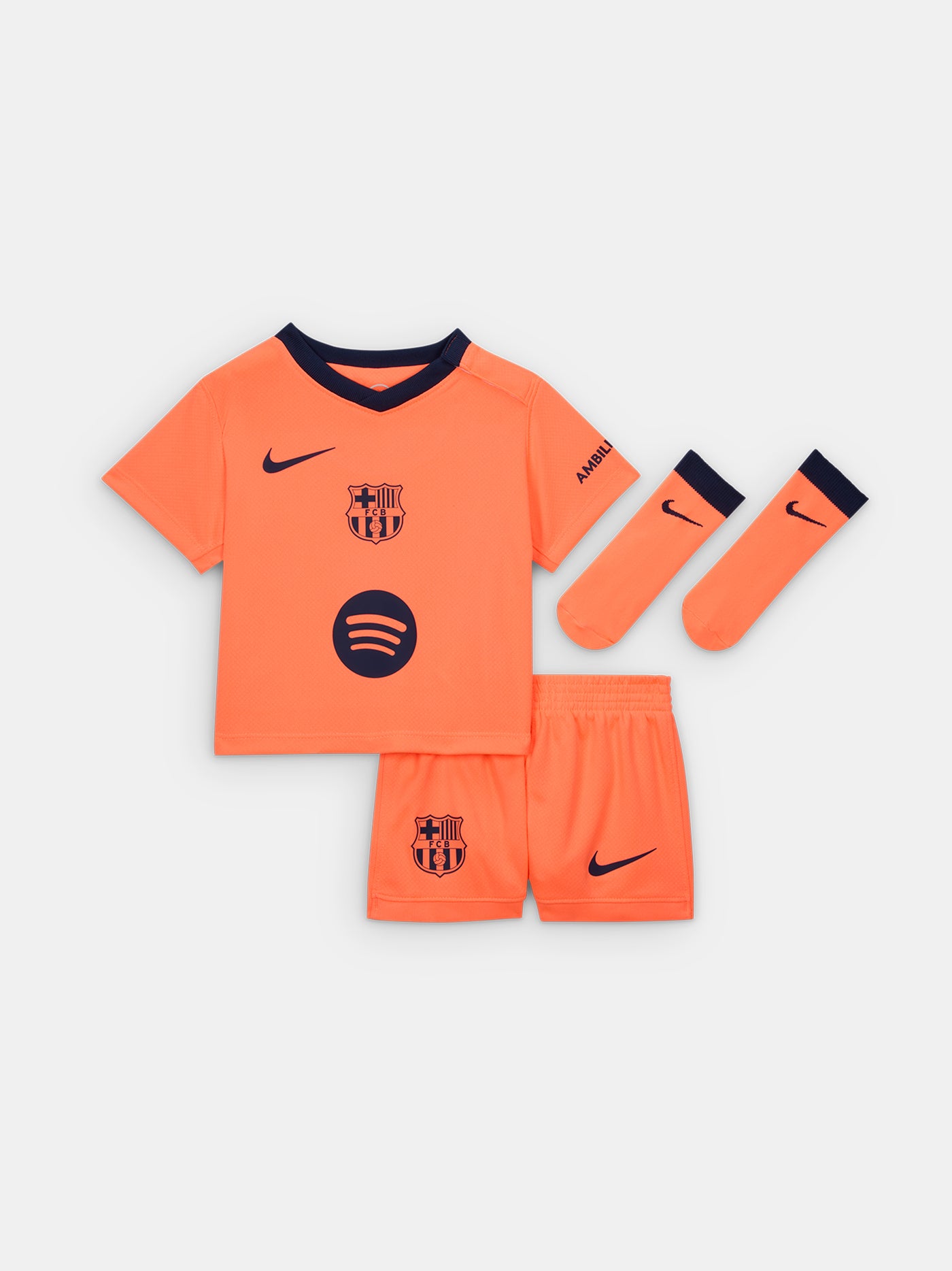 FC Barcelona 2025/26 third kit for toddlers in orange with navy blue details, including shirt, shorts, and socks.