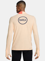 FC Barcelona long-sleeve peach training top with navy Nike logo, club crest, Spotify sponsor, and coral shoulder detail