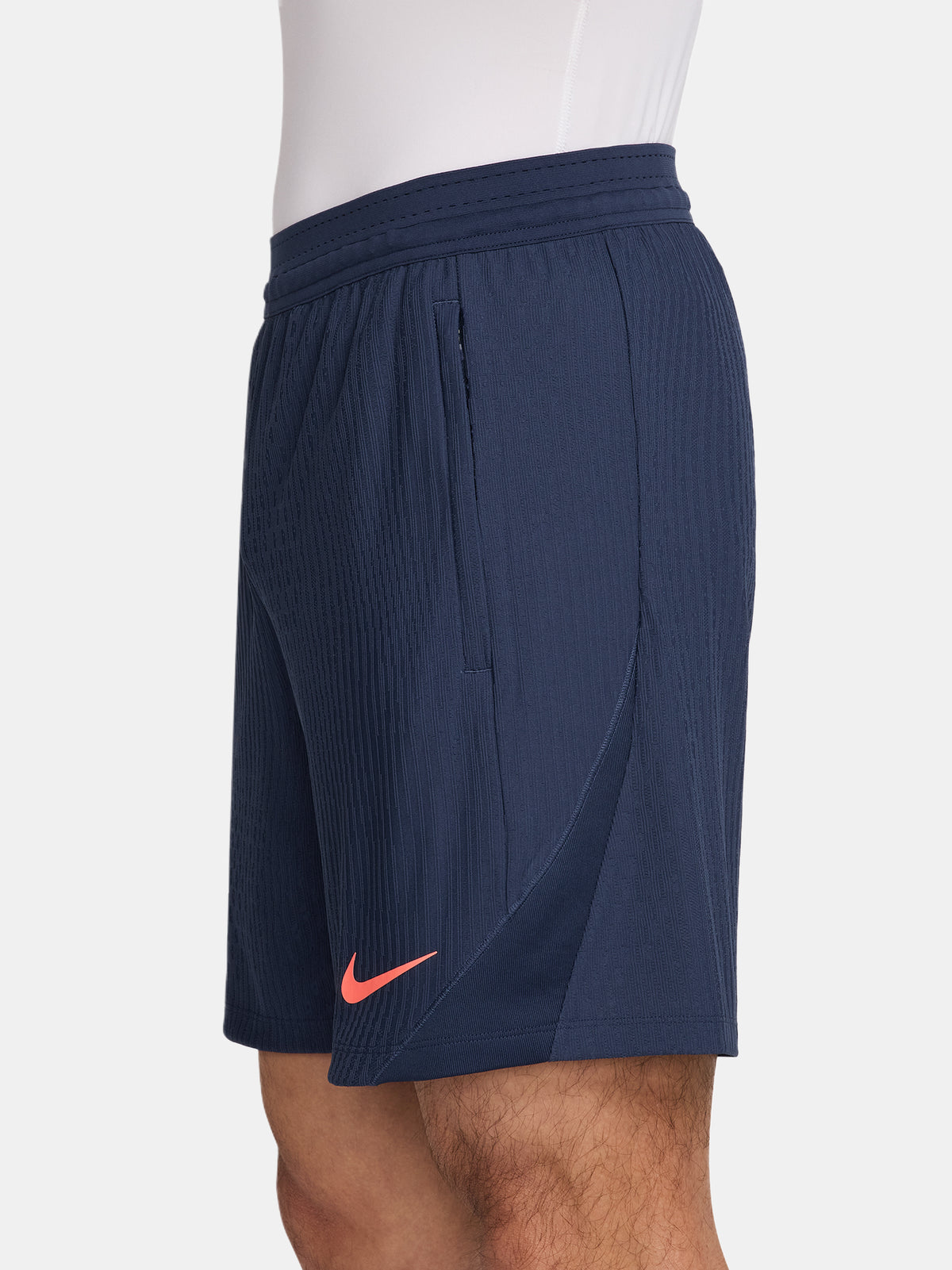 FC Barcelona navy blue training shorts with coral Nike logo and club crest