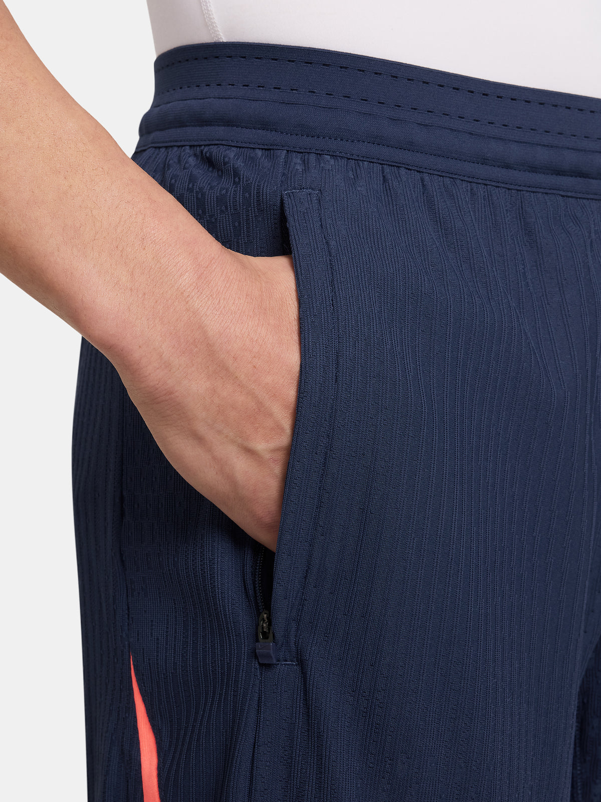 FC Barcelona navy blue training shorts with coral Nike logo and club crest