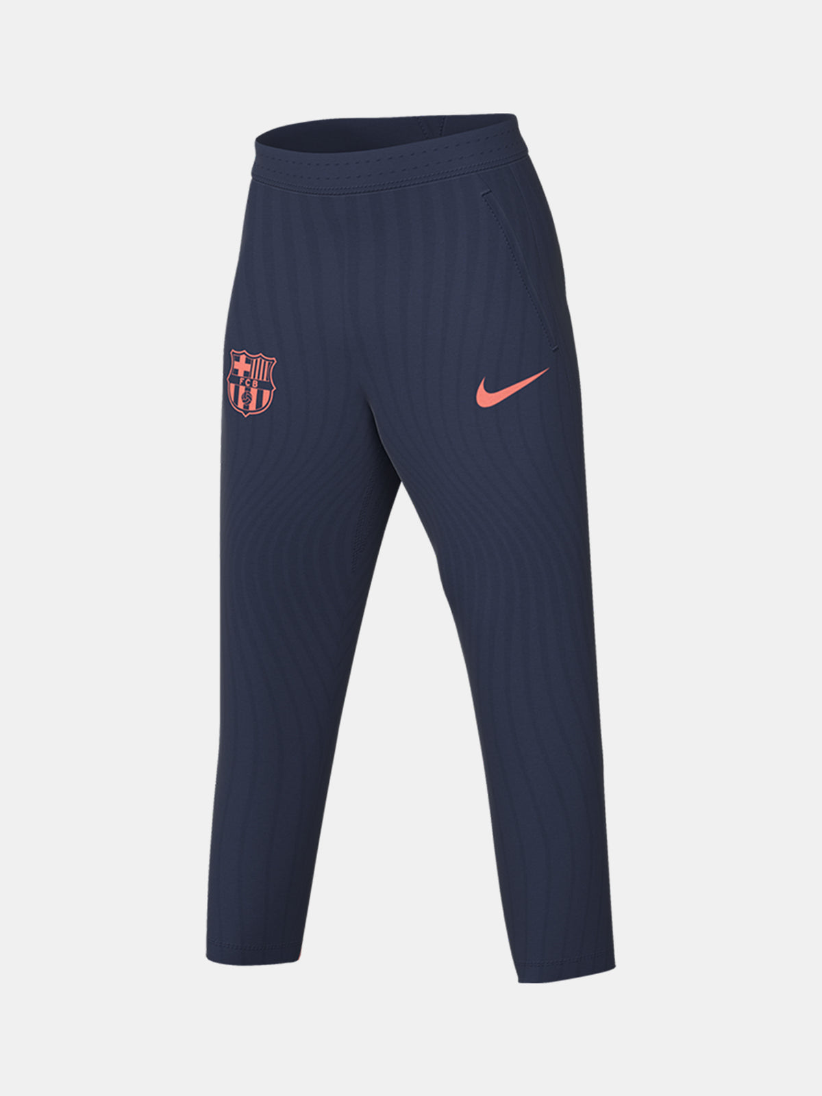 FC Barcelona navy blue training pants with slim fit, featuring the club crest and Nike logo in coral on the front