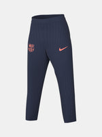 FC Barcelona navy blue training pants with slim fit, featuring the club crest and Nike logo in coral on the front