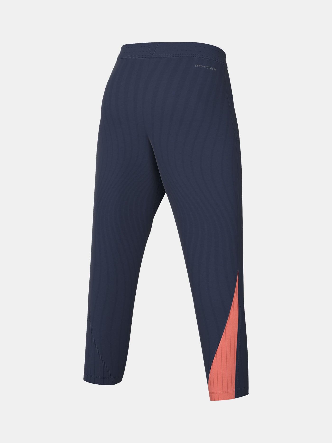 FC Barcelona navy blue training pants with slim fit, featuring the club crest and Nike logo in coral on the front
