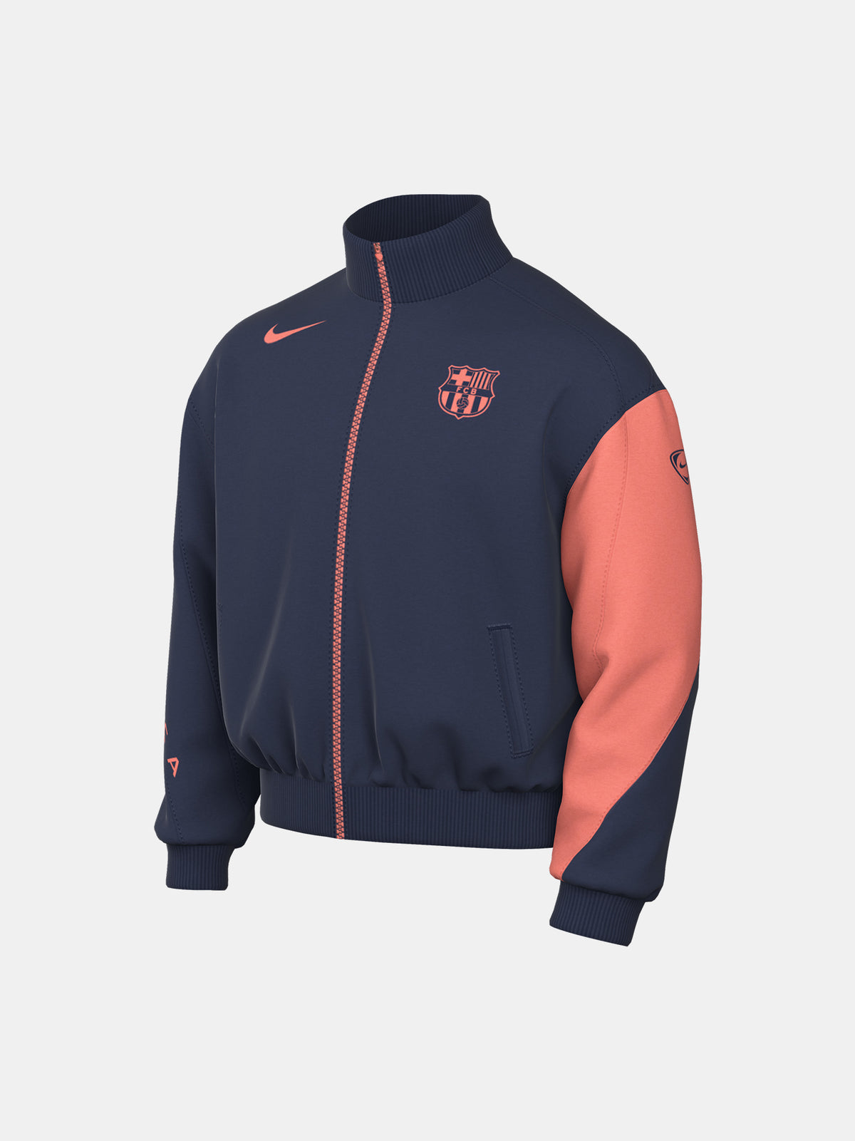 FC Barcelona navy blue jacket with coral details, including a coral sleeve, zipper, Nike logo, and club crest, paired with white Nike pants.