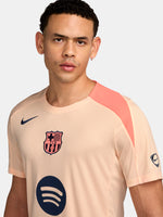 FC Barcelona light pink training jersey with navy Nike logo, Spotify sponsor, and club crest on the chest.