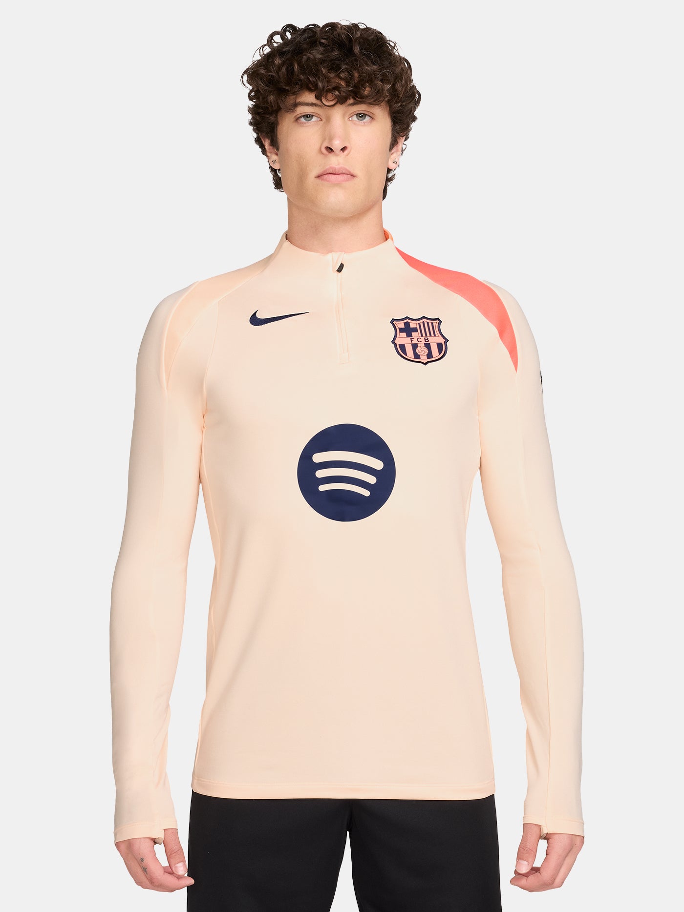FC Barcelona long-sleeve peach training top with navy Nike logo, club crest, Spotify sponsor, and coral shoulder detail