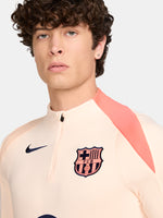 FC Barcelona long-sleeve peach training top with navy Nike logo, club crest, Spotify sponsor, and coral shoulder detail