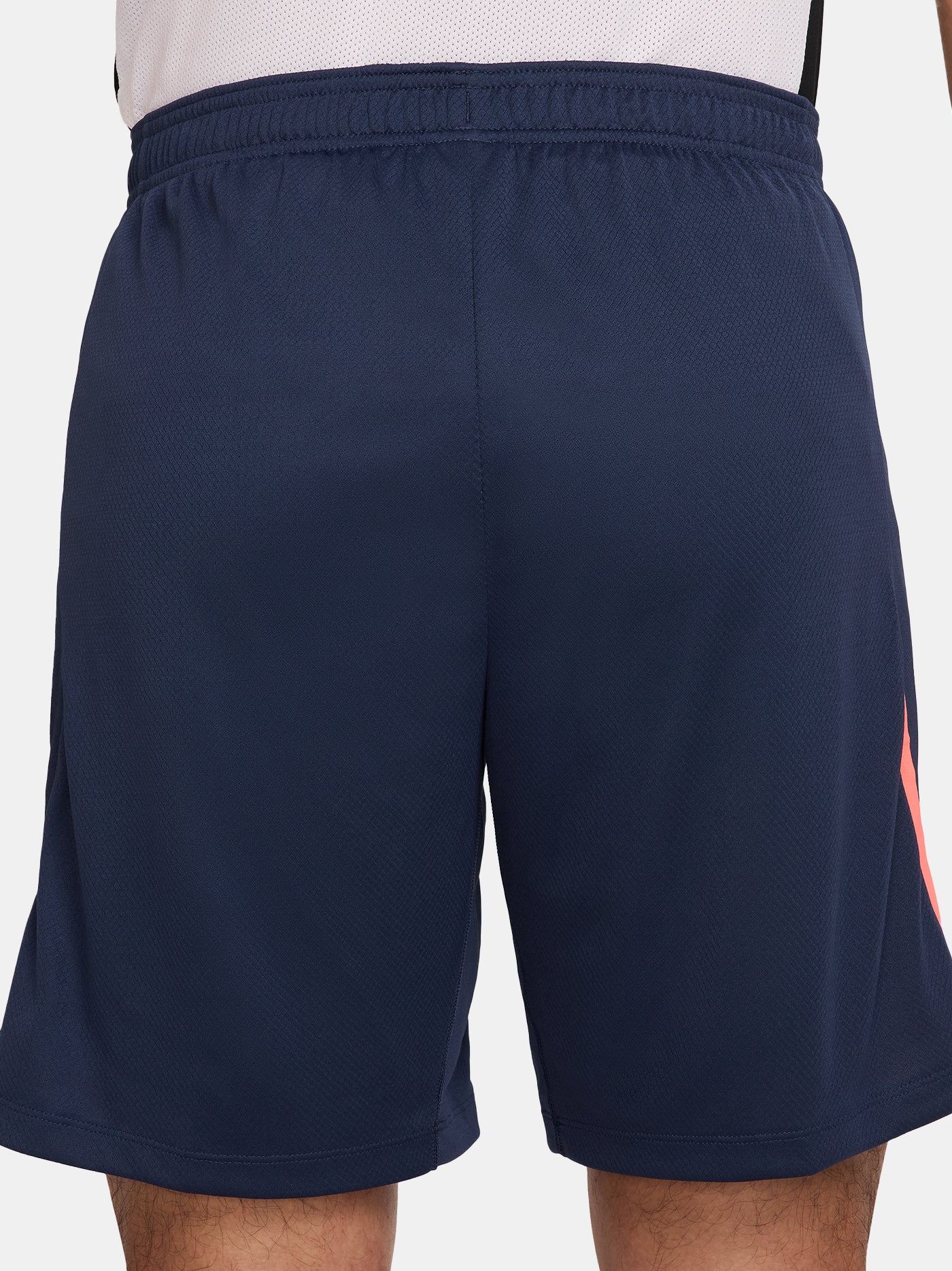 FC Barcelona navy blue training shorts with coral Nike logo and club crest