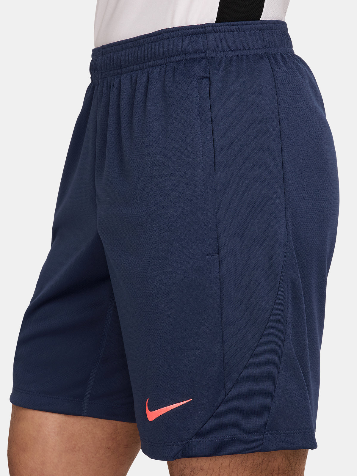 FC Barcelona navy blue training shorts with coral Nike logo and club crest