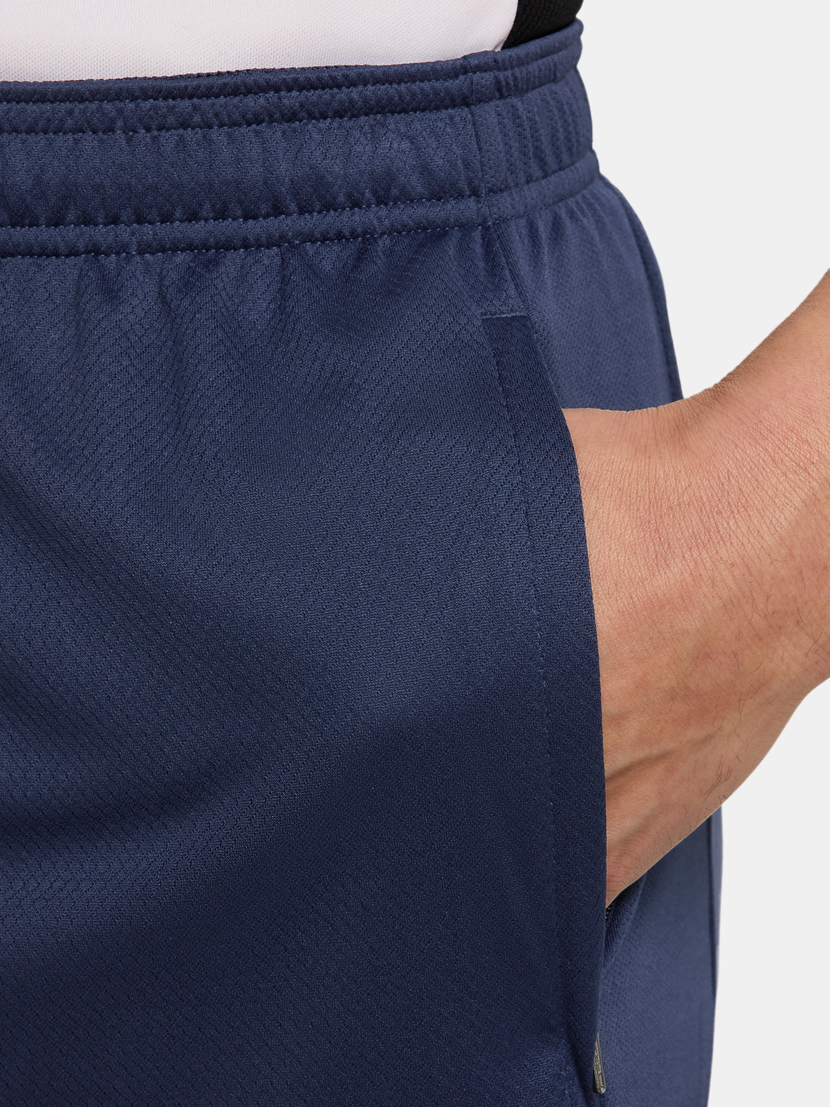 FC Barcelona navy blue training shorts with coral Nike logo and club crest