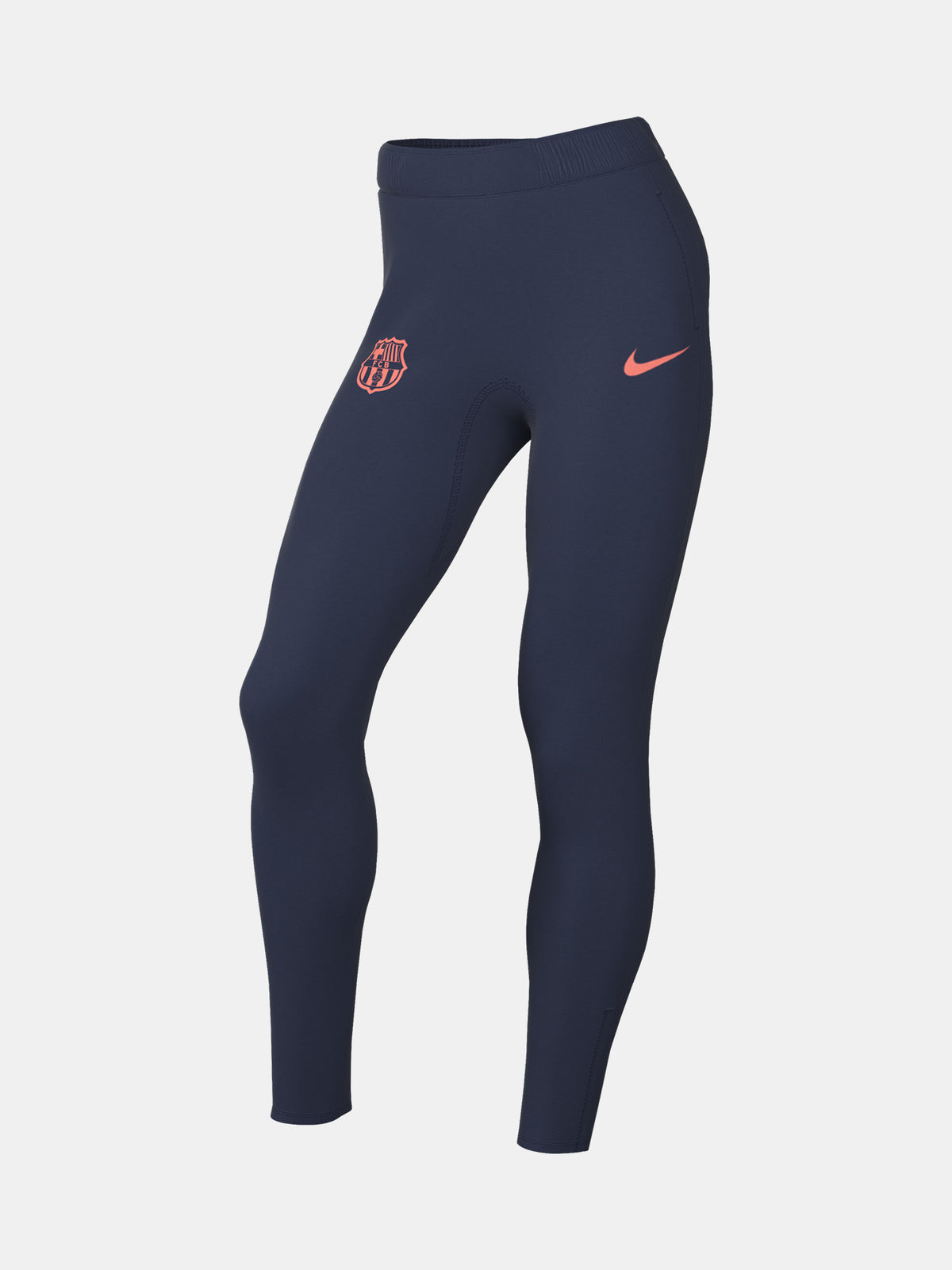 FC Barcelona navy blue training pants with slim fit, featuring the club crest and Nike logo in coral on the front
