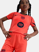 FC Barcelona third kit football shorts in orange with navy blue Nike logo and club crest