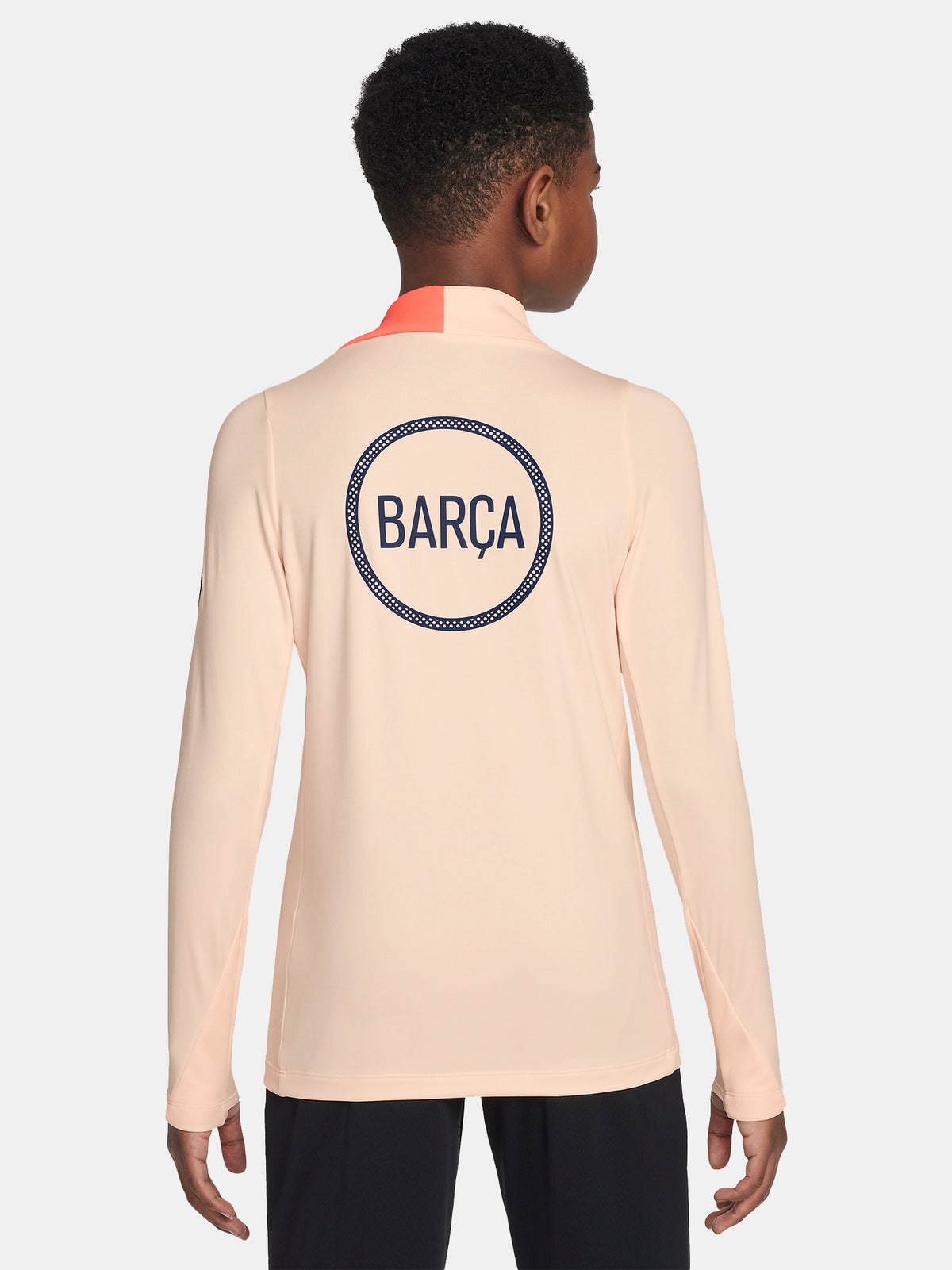 FC Barcelona long-sleeve peach training top with navy Nike logo, club crest, Spotify sponsor, and coral shoulder detail