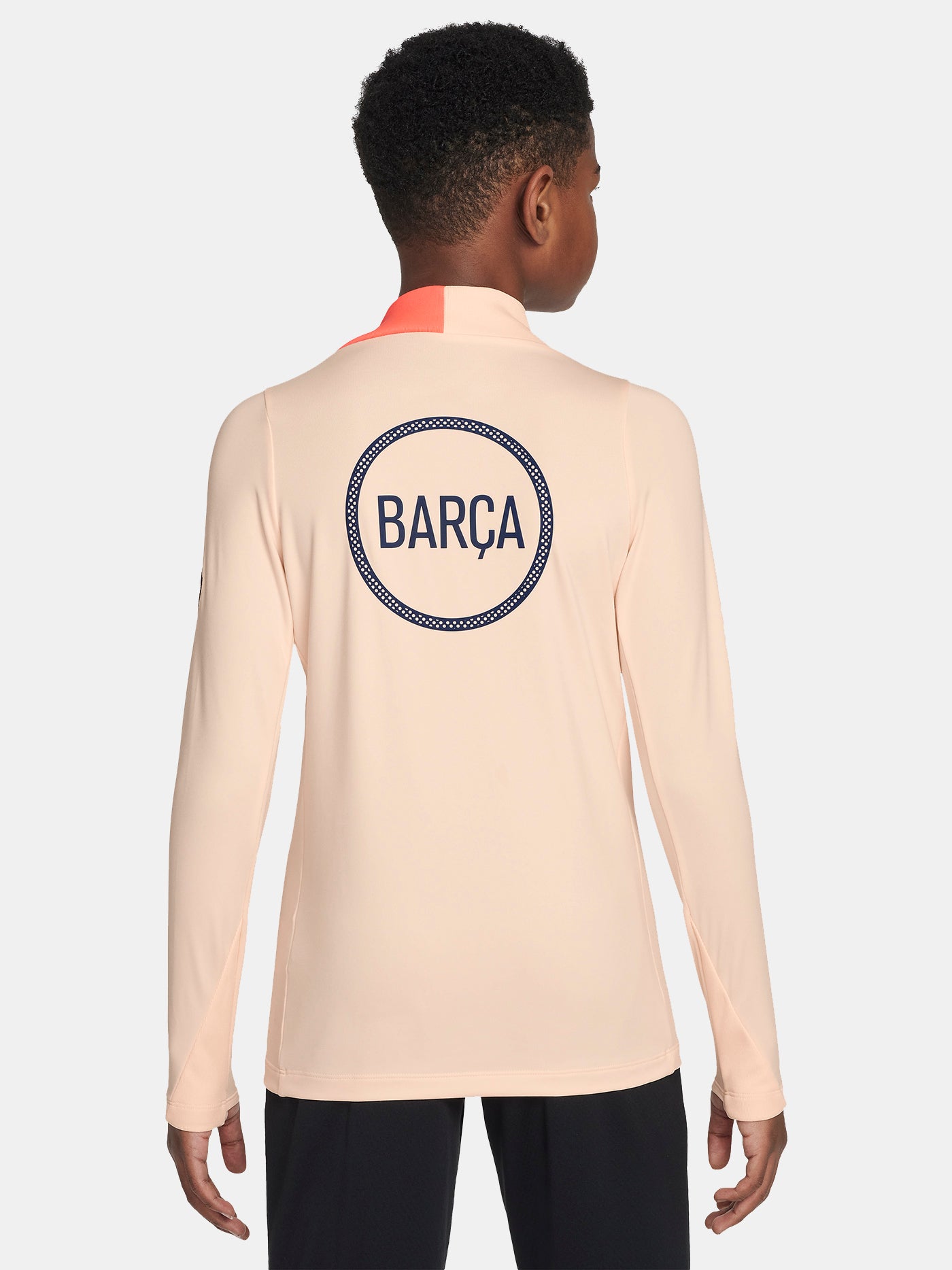 FC Barcelona long-sleeve peach training top with navy Nike logo, club crest, Spotify sponsor, and coral shoulder detail