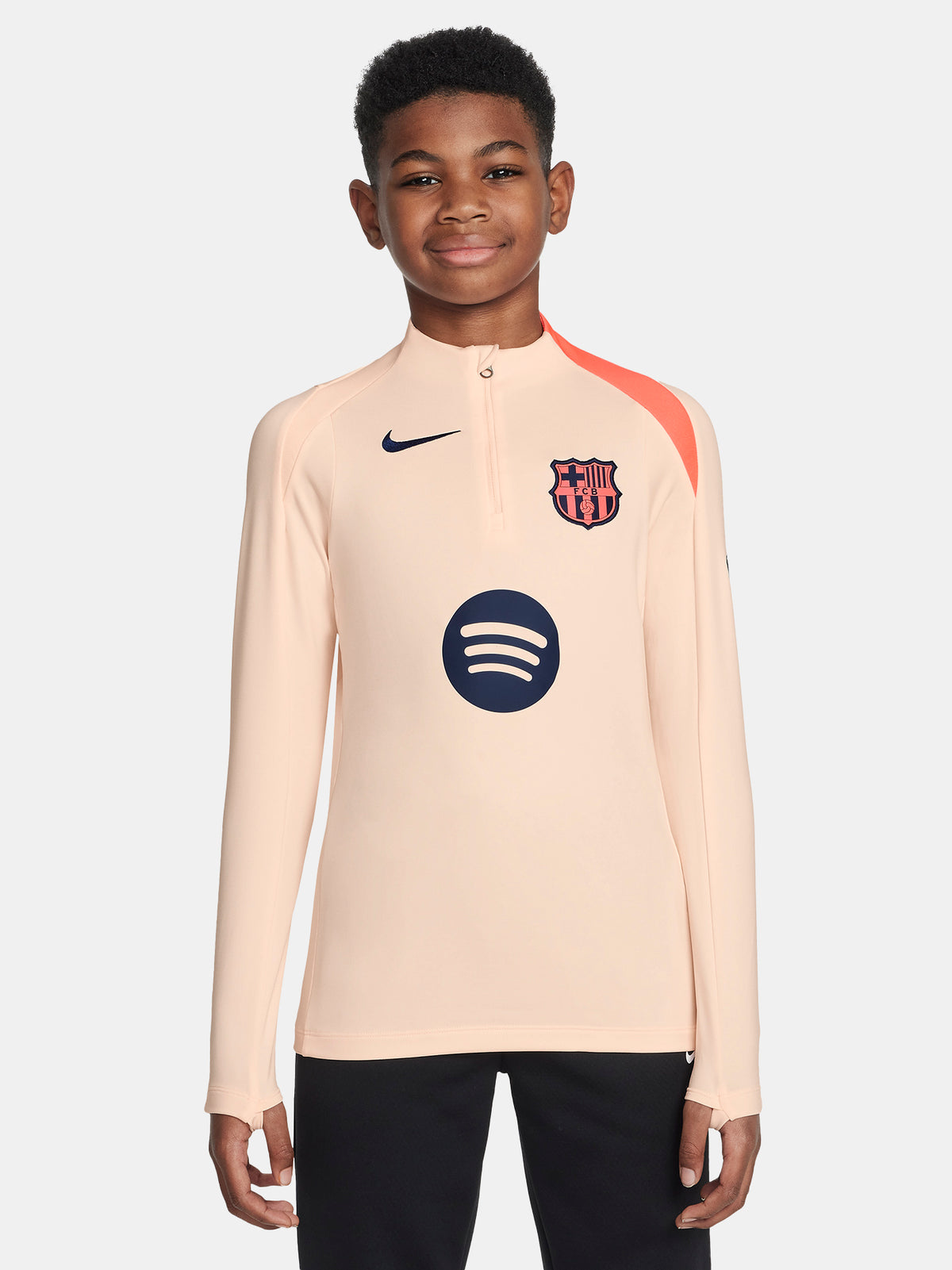 FC Barcelona long-sleeve peach training top with navy Nike logo, club crest, Spotify sponsor, and coral shoulder detail