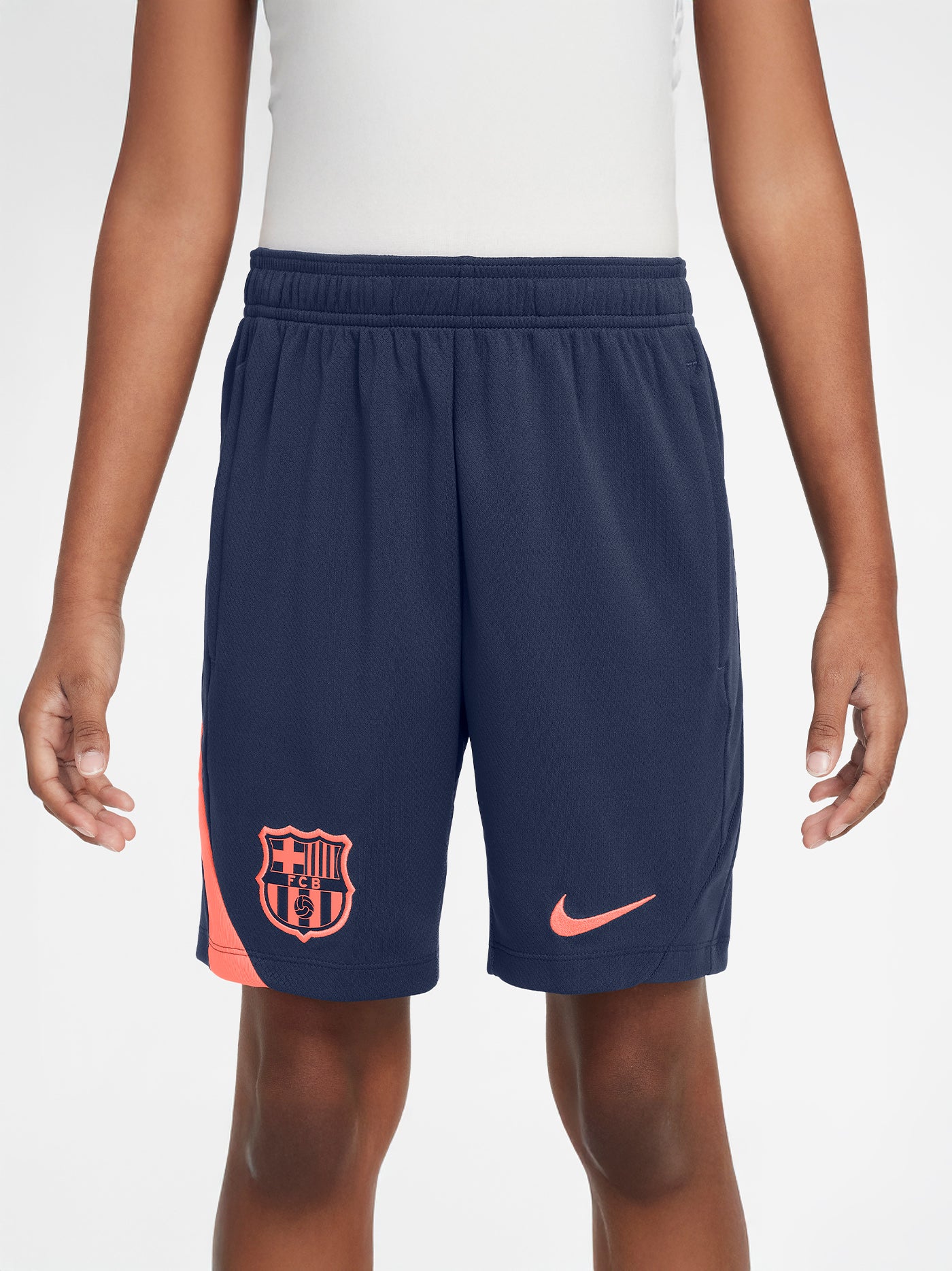 FC Barcelona navy blue training shorts with coral Nike logo and club crest