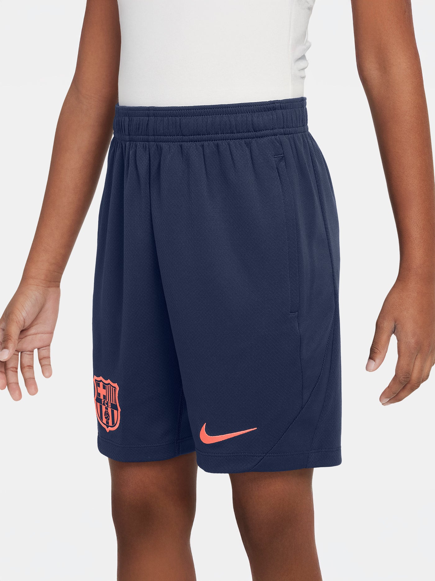 FC Barcelona navy blue training shorts with coral Nike logo and club crest