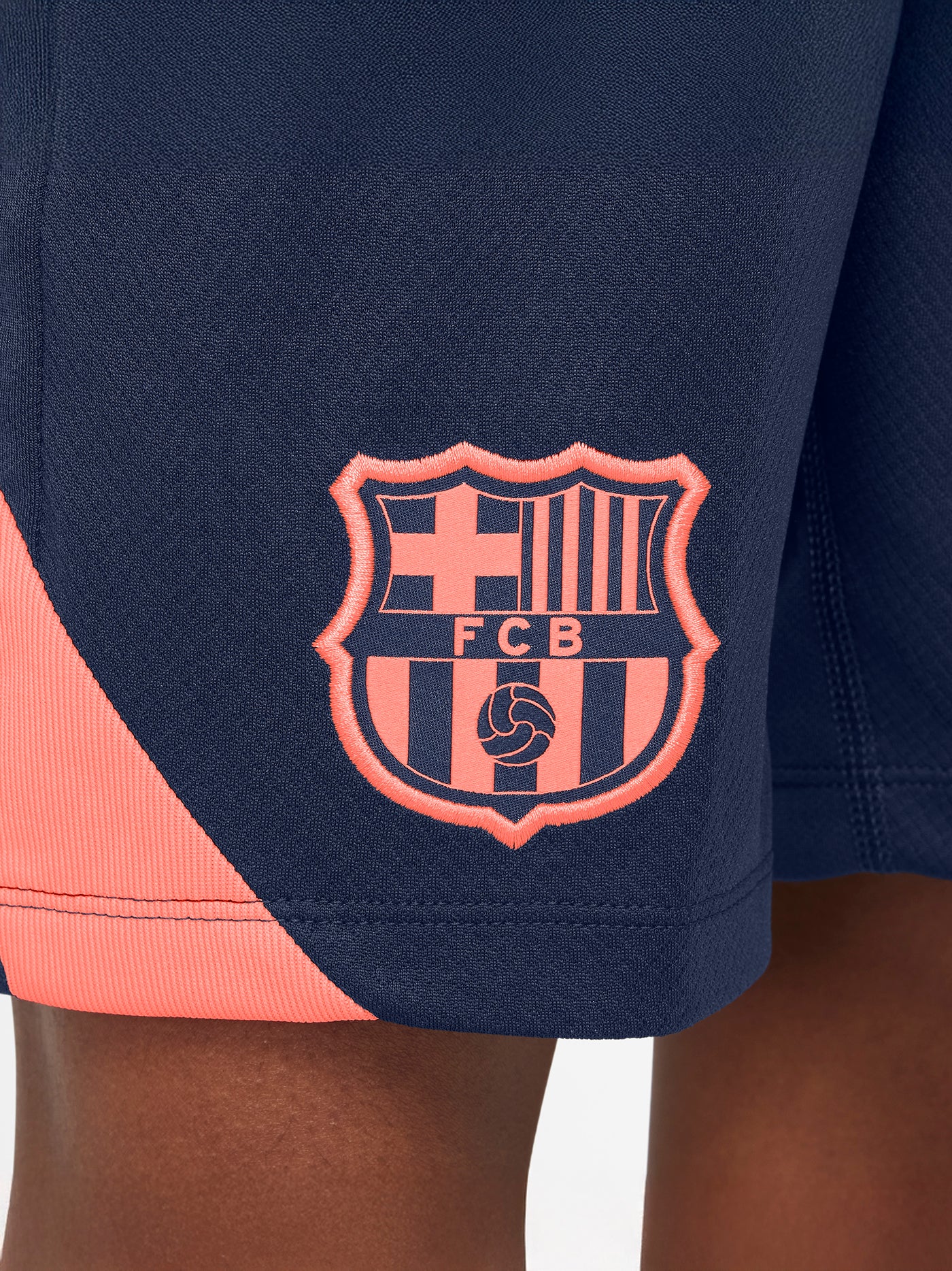 FC Barcelona navy blue training shorts with coral Nike logo and club crest