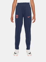 FC Barcelona navy blue training pants with slim fit, featuring the club crest and Nike logo in coral on the front