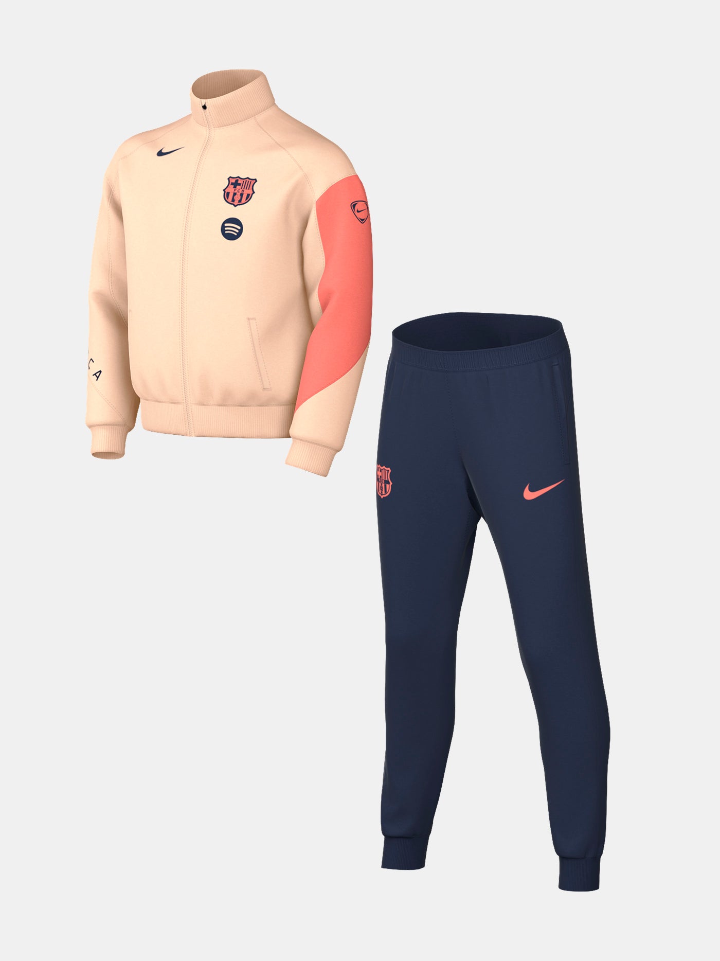 FC Barcelona Nike jacket with coral sleeve detail, paired with navy jogger pants featuring the club crest and Nike swoosh