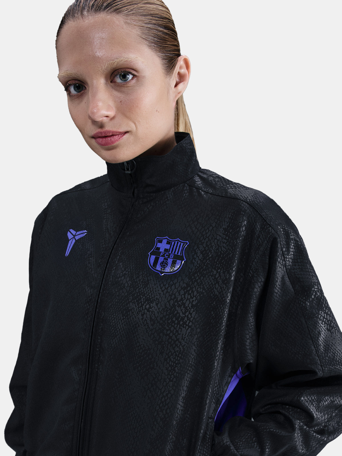 Black FC Barcelona jacket with a subtle textured pattern, featuring the Kobe Bryant logo on the left chest and the FC Barcelona crest in purple on the right chest