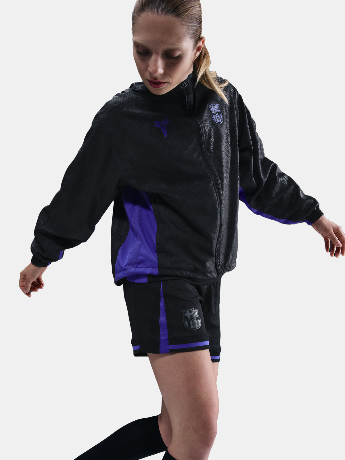 Black FC Barcelona jacket with a subtle textured pattern, featuring the Kobe Bryant logo on the left chest and the FC Barcelona crest in purple on the right chest