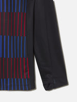 FC Barcelona long sleeve training top with red and blue striped pattern and red logos.