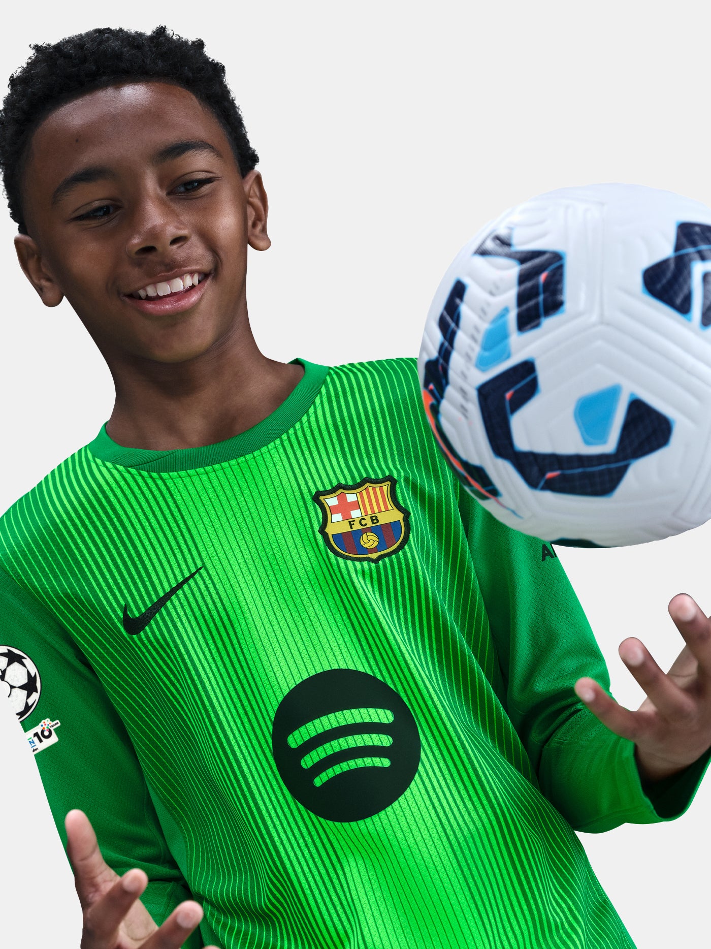 Barça goalkeeper jersey in vivid green with vertical black pinstripes. Fearless style for Goalkeepers.