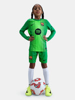 Matching green goalkeeper shorts with Barça crest and Nike swoosh. 