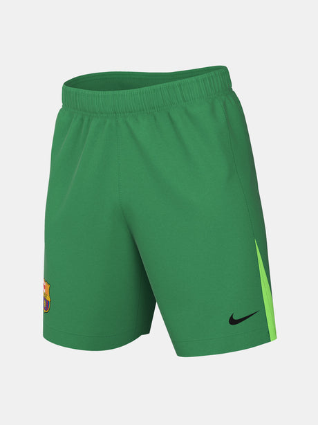 Matching green goalkeeper shorts with Barça crest and Nike swoosh. 
