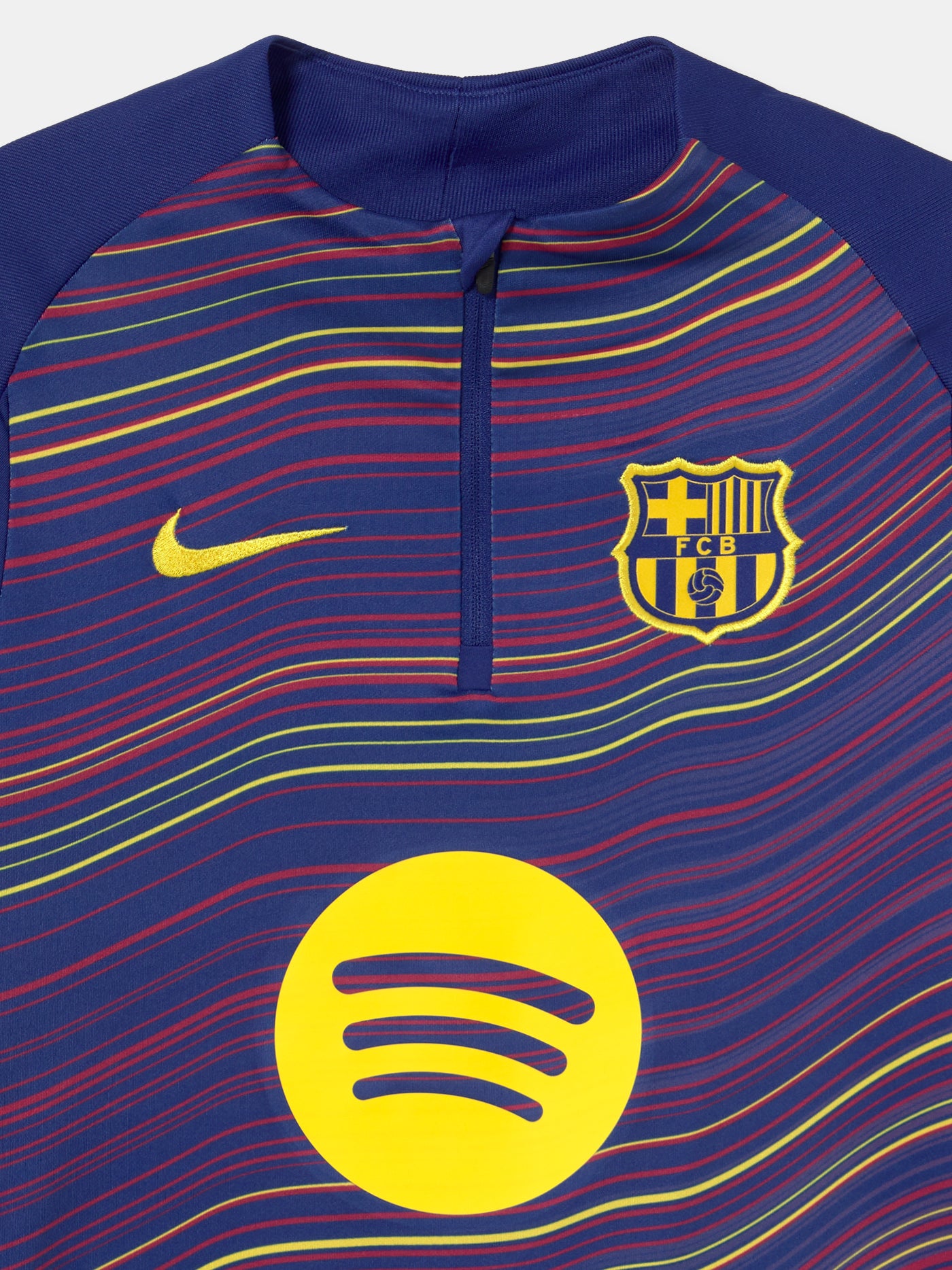 Front view of FC Barcelona 25/26 long-sleeve training top with wavy multicolor pattern, Spotify logo, Nike swoosh, and club crest.