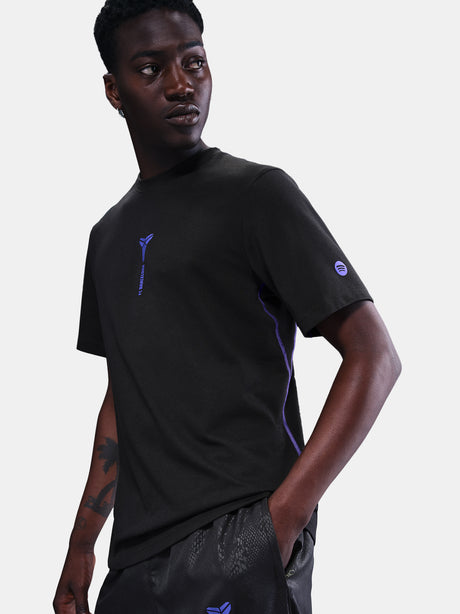 Black FC Barcelona T-shirt with blue Kobe Bryant logo on the chest, paired with black shorts featuring the same emblem.