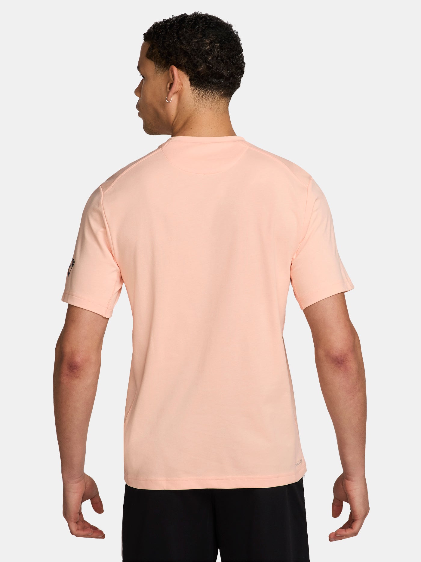 Light pink FC Barcelona Nike t-shirt with short sleeves, featuring the club crest and Spotify sponsor on the chest