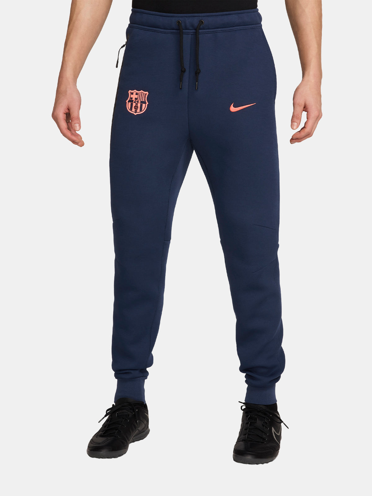 Navy FC Barcelona Nike jogger pants with red crest and Nike swoosh on the front.