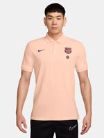 FC Barcelona light peach polo shirt with collar, featuring the club crest and Spotify logo on the chest alongside the Nike swoosh in navy