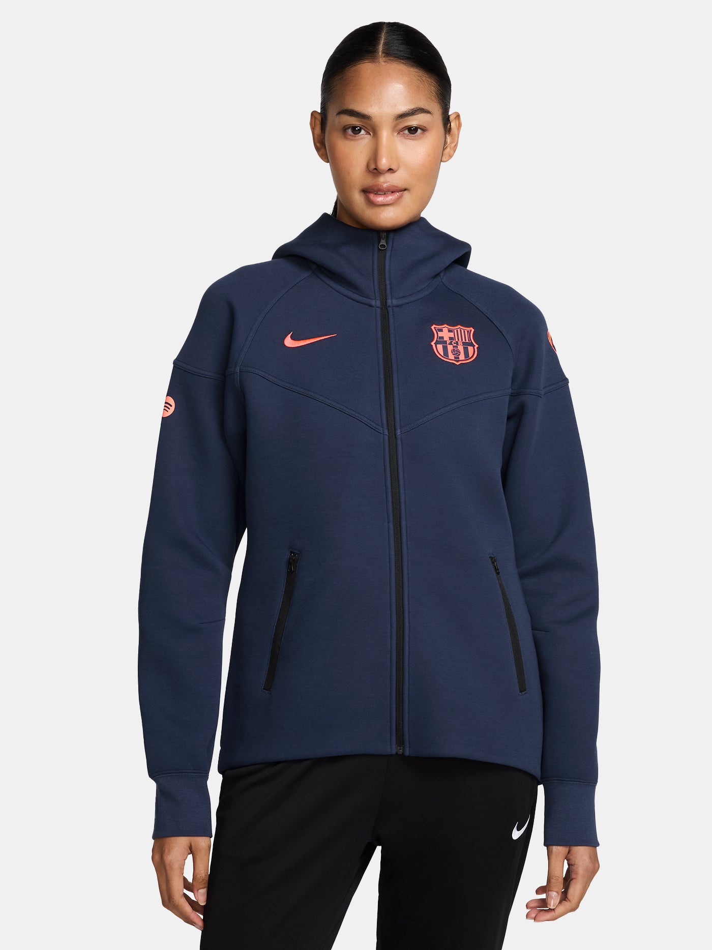 Navy FC Barcelona Nike zip-up hoodie featuring red crest and Nike swoosh on the chest.