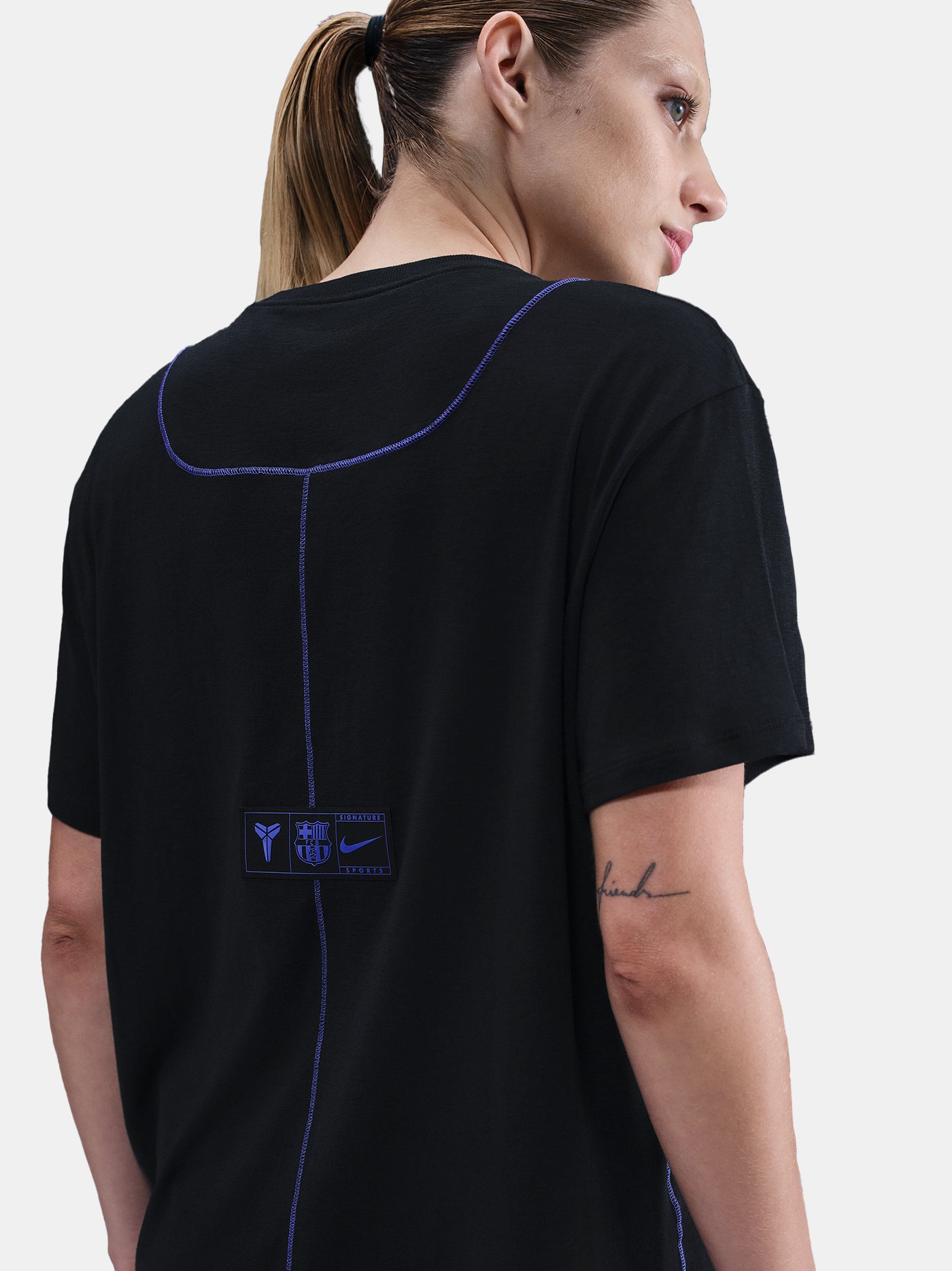 Black FC Barcelona T-shirt with blue Kobe Bryant logo on the chest, paired with black shorts featuring the same emblem.