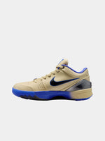 Beige and blue sneaker with Nike logo on a white background